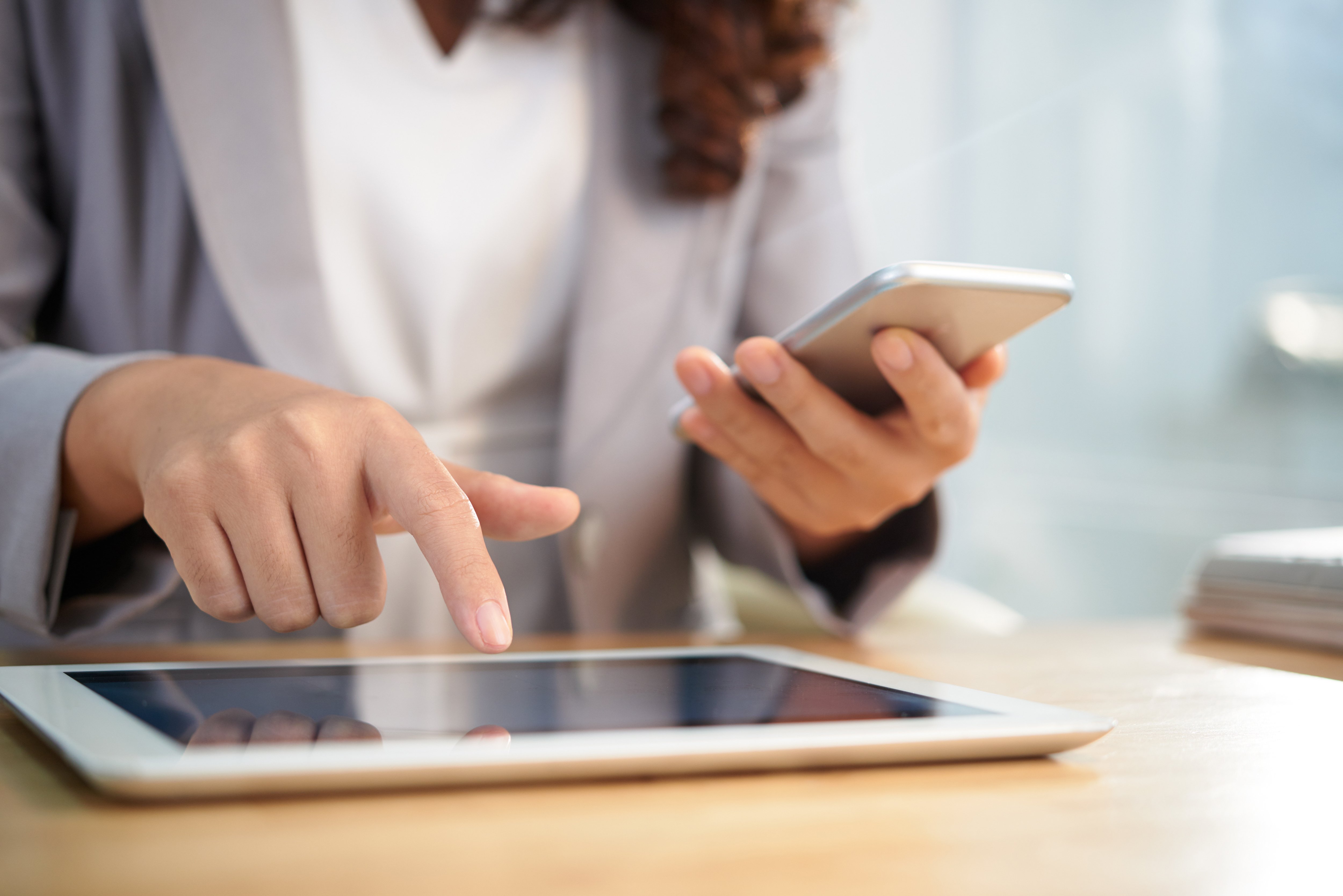 hands-anonymous-business-woman-using-digital-tablet-smartphone-work