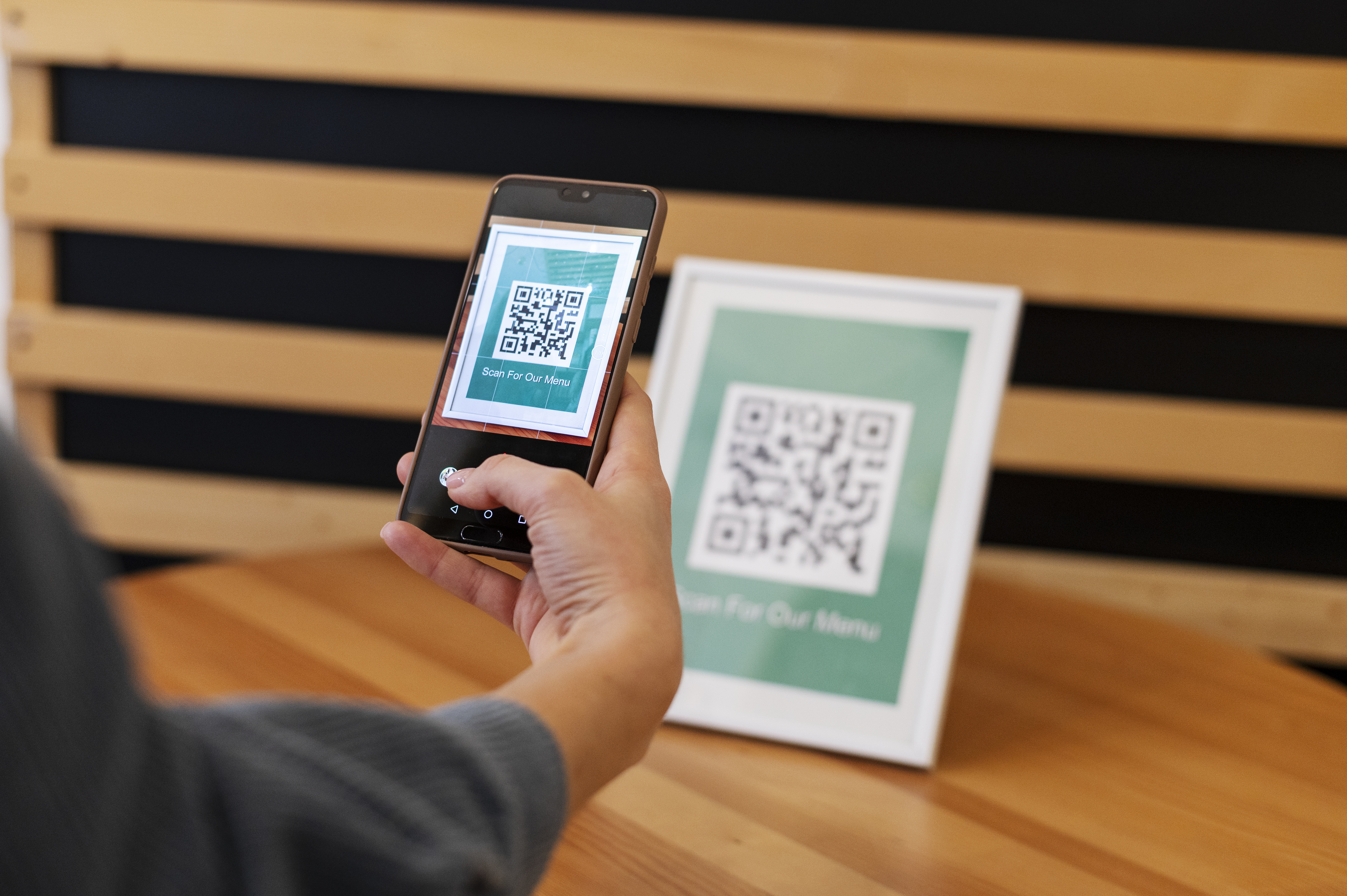 person-scanning-qr-code